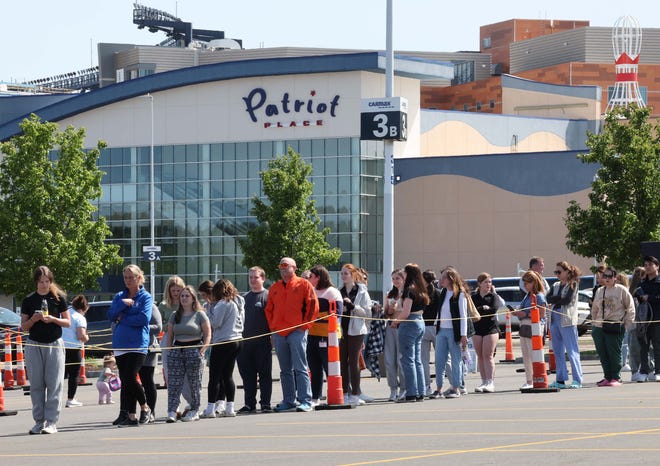 Thousands of Taylor Swift fans lineup to purchase merchandise outside Gillette Stadium on Thursday, May 18, 2023.