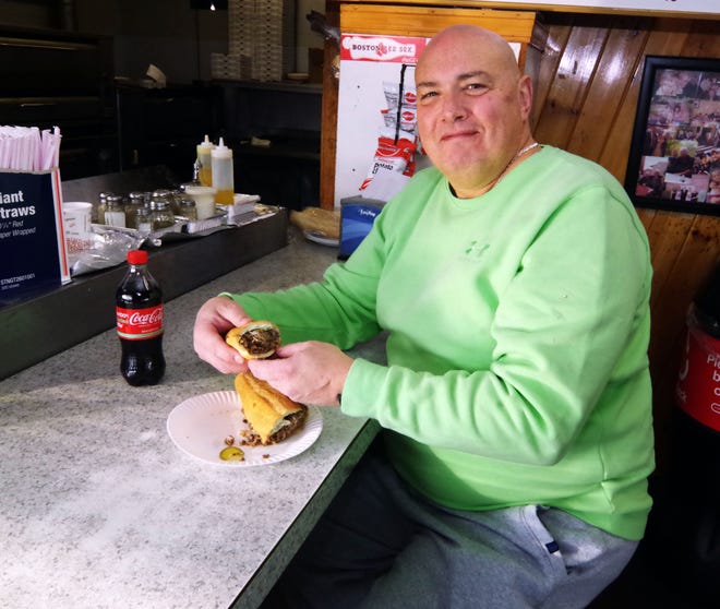 John Franovich of Rockland can't wait to dig in to his Supreme House of Pizza steak & cheese sandwich on Tuesday, Nov. 14, 2023, and would have immediately -- if not for a request to be photographed for this story.