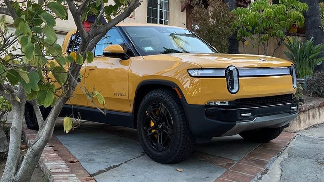 The Rivian R1T in compass yellow