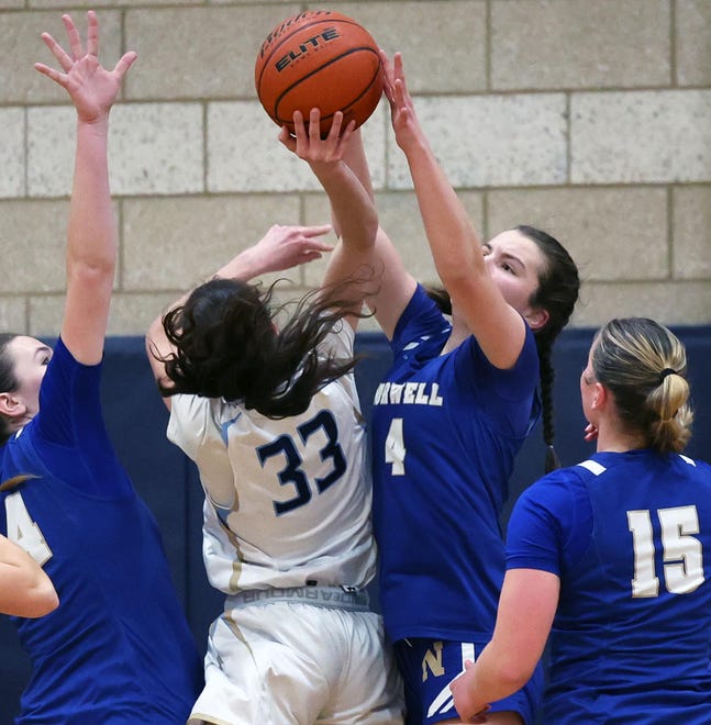 Norwell's Alex Cassidy blocks the shot on East Bridgewater's Shania Gardner and was called for a foul during a game on Friday, Jan. 5, 2024.