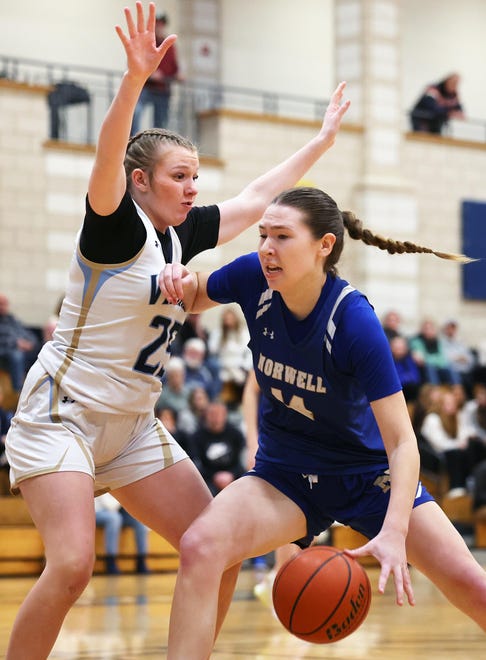 Norwell's Madison Oliver attempts to dribble around East Bridgewater defender Jessica Long during a game on Friday, Jan. 5, 2024.