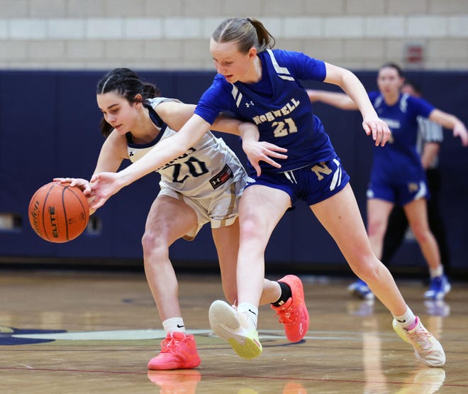 East Bridgewater's Liv McManus and Norwell's Heidi Warren go after a loose ball during a game on Friday, Jan. 5, 2024.