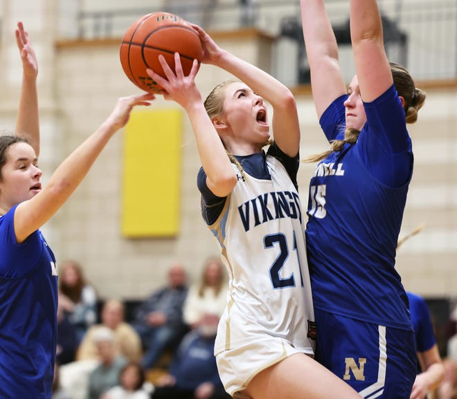East Bridgewater's Emma Farrell drives to the basket on Norwell defender Reagan Dowd during a game on Friday, Jan. 5, 2024.