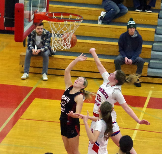 North Quincy's Molly Toland goes up for a shot at the net but is rejected by B-R's Reese Bartlett in 2nd half action on Monday, Jan. 8, 2024.