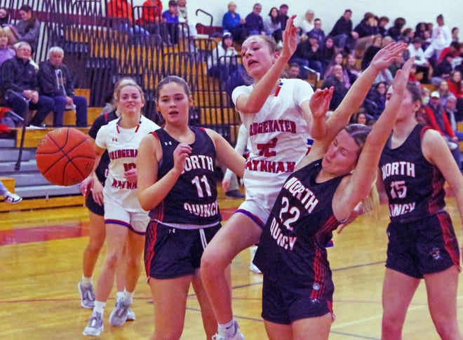 B-R's Camden Strandberg is sandwiched in betweetn North Quincy's #11 Jillian Jaehnig #11 (L) and #22 Molly Toland (R) as all three were fighting for a rebound in the 1st half of the game on Monday, Jan. 8, 2024.