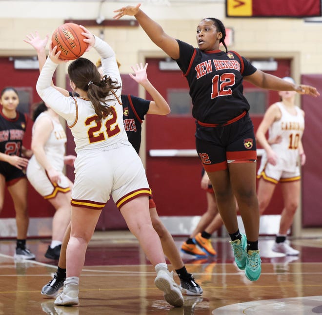 New Heights defender Naziiah Herisse guards Cardinal Spellman's Lucy LaCara during a game on Tuesday, Jan. 9, 2024.