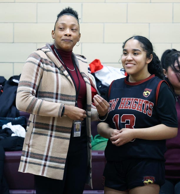 New Heights head coach JoJo Veiga gives instructions to Jaelah Farris during a game versus Cardinal Spellman on Tuesday, Jan. 9, 2024.
