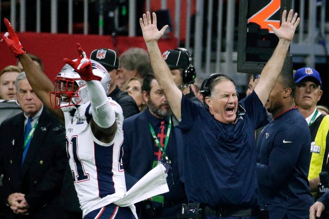 New England Patriots' Duron Harmon (21) and head coach Bill Belichick celebrate after the NFL Super Bowl 53 football game against the Los Angeles Rams in Atlanta, Feb. 3, 2019.