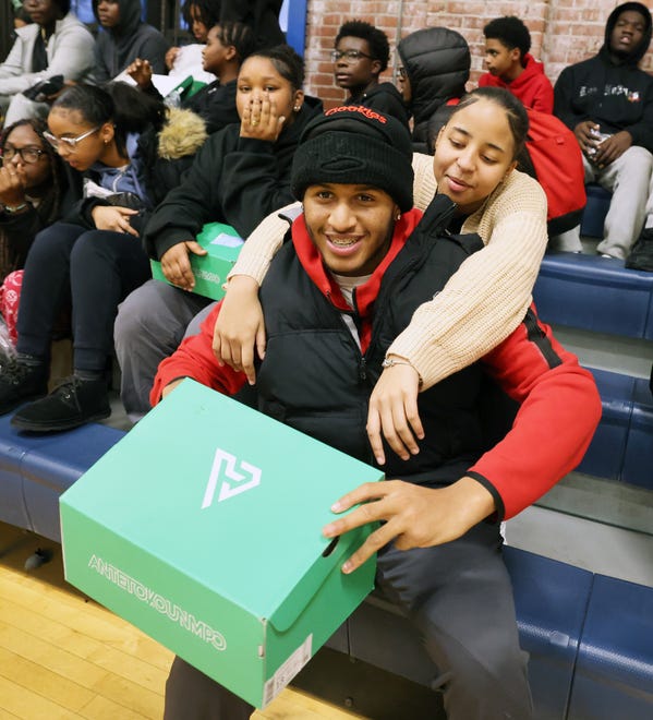 Brian Resendes, 17, received sneakers from Brockton's AJ Dybantsa, 16, who visited the Boys & Girls Clubs of Metro South on Wednesday, Jan. 10, 2024.