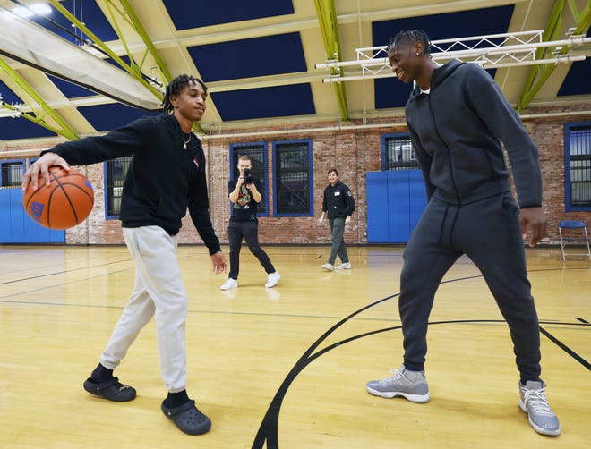 Landon Boswell, 16, left, plays a one-on-one basketball game with Brockton's AJ Dybantsa, 16, who visited the Boys & Girls Clubs of Metro South on Wednesday, Jan. 10, 2024.