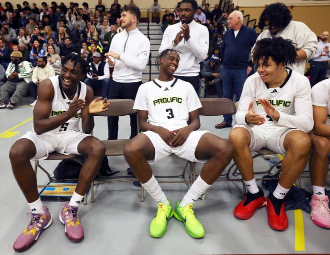 Prolific Prep's AJ Dybantsa, center, with teammates from left, Zoom Diallo and Tyran Stokes share a laugh before a game versus Orangeville Prep on Wednesday, Jan. 10, 2024.