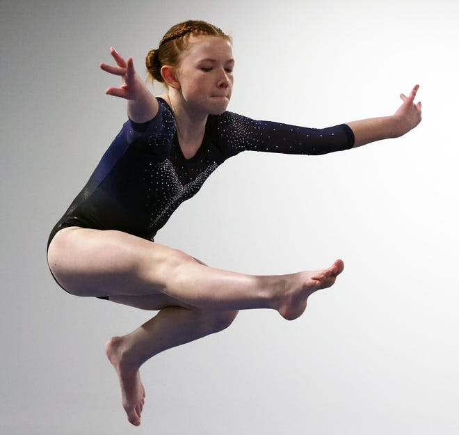Notre Dame Academy's Sam Carpenter competes in the beam event at Spectrum Gymnastics on Saturday, Jan. 13, 2024.