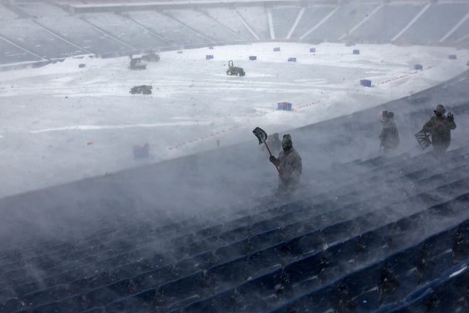 January 14, 2024Workers remove snow from Highmark Stadium in Orchard Park, N.Y. A potentially dangerous snowstorm that hit the Buffalo region on Saturday led the NFL to push back the Bills wild-card playoff game against the Pittsburgh Steelers from Sunday to Monday. New York Gov. Kathy Hochul and the NFL cited public safety concerns for the postponement, with up to 2 feet of snow projected to fall on the region over a 24- plus hour period.